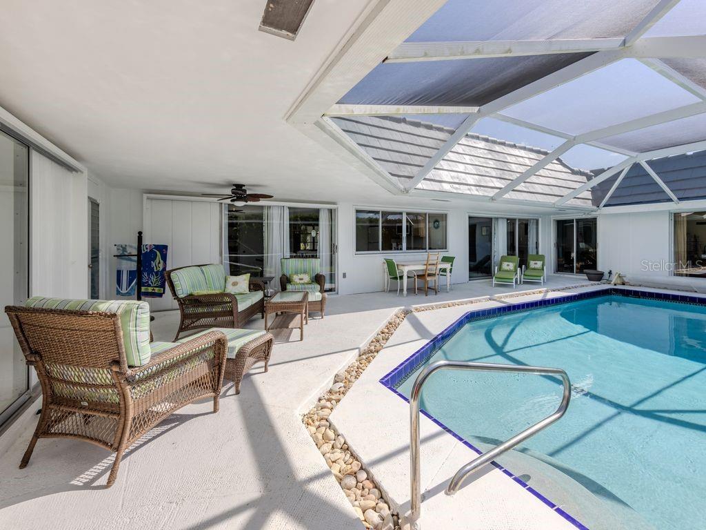601 Apalachicola Road Venice, FL 34285 - Photo 5 of 33 a living room with furniture pool table and chairs