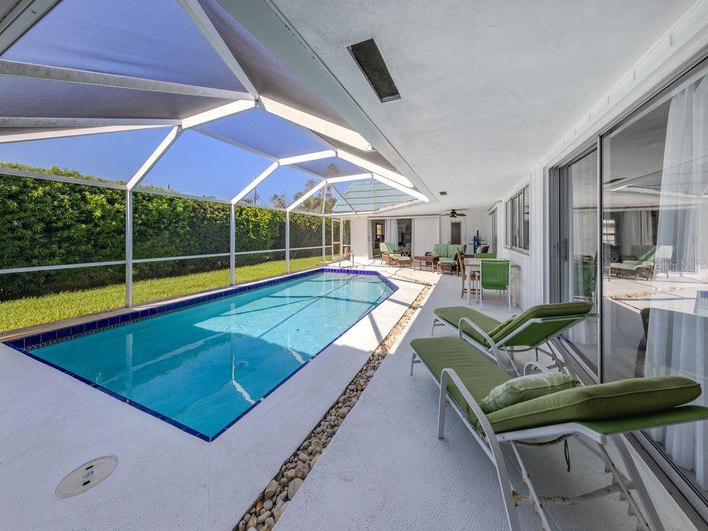 601 Apalachicola Road Venice, FL 34285 - Photo 6 of 33 a living room with furniture pool table and chairs