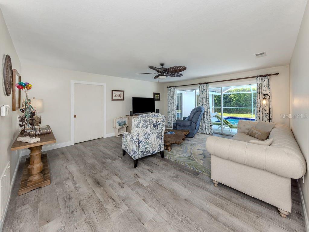 601 Apalachicola Road Venice, FL 34285 - Photo 7 of 33 a living room with furniture and a large window