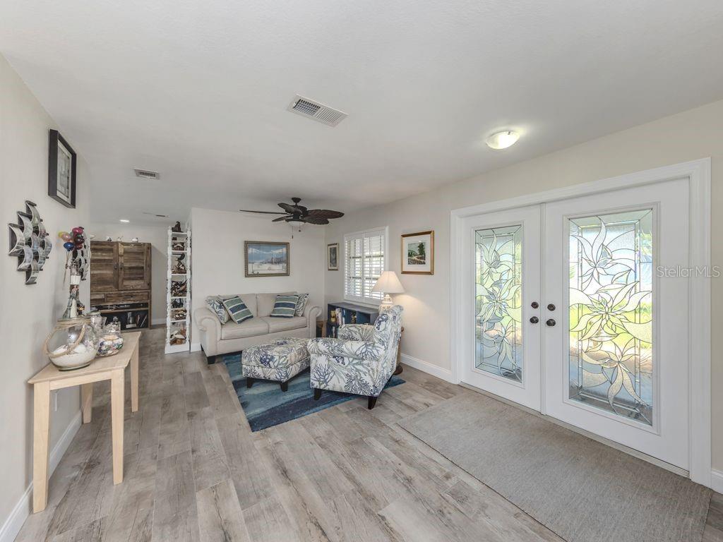 601 Apalachicola Road Venice, FL 34285 - Photo 10 of 33 a living room with furniture and a flat screen tv