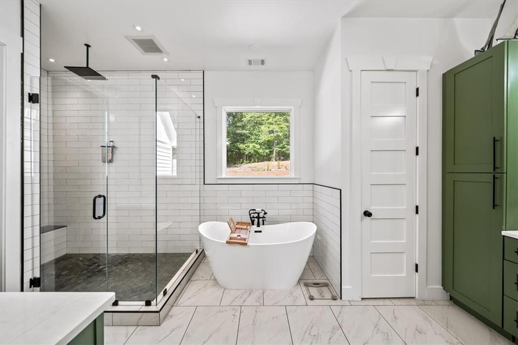 1380 Cronic Town Road Auburn, GA 30011 - Photo 17 of 69 a bathroom with a bathtub and shower