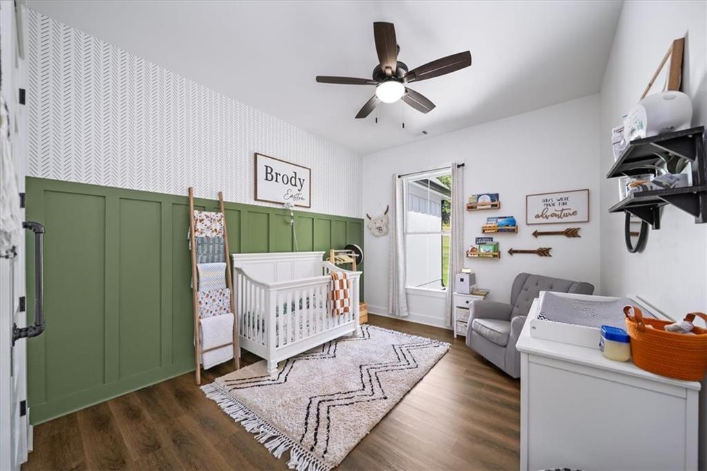 1380 Cronic Town Road Auburn, GA 30011 - Photo 25 of 69 a living room with a bed furniture and a window