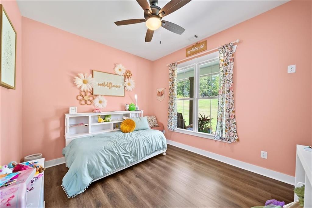 1380 Cronic Town Road Auburn, GA 30011 - Photo 27 of 69 a bedroom with a bed and a window