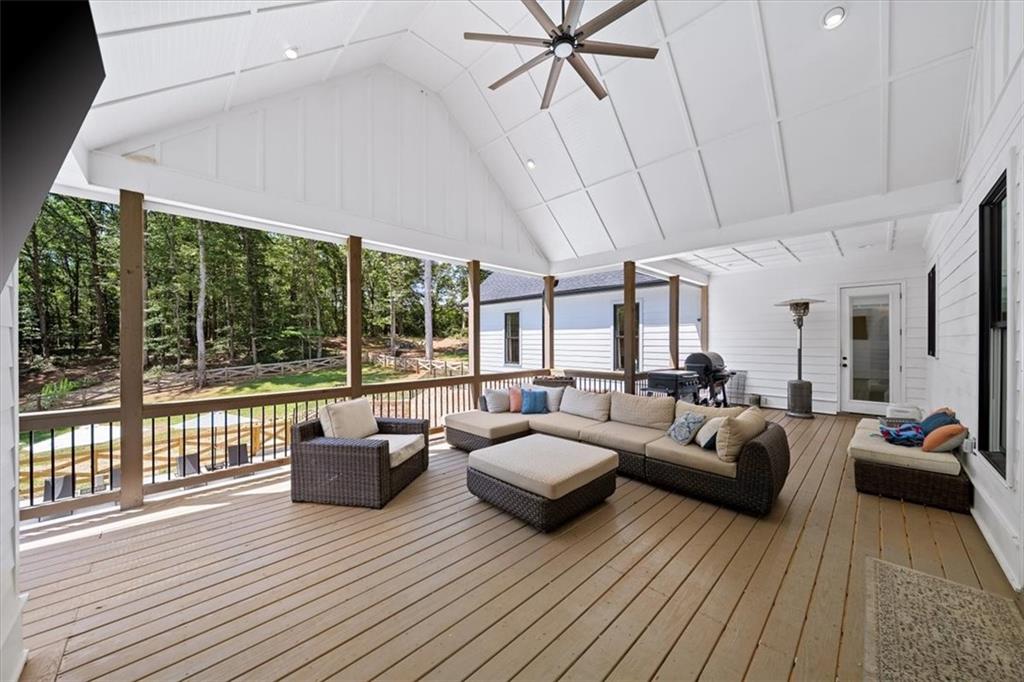 1380 Cronic Town Road Auburn, GA 30011 - Photo 36 of 69 a living room with furniture large windows and wooden floor