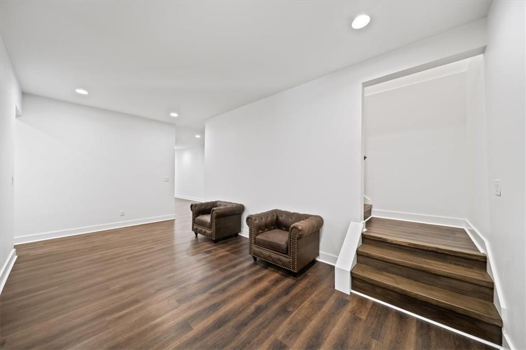 1380 Cronic Town Road Auburn, GA 30011 - Photo 39 of 69 a room with furniture and a wooden floor