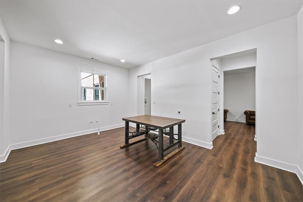 1380 Cronic Town Road Auburn, GA 30011 - Photo 44 of 69 a view of a work space with wooden floor and a window