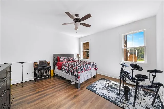 a view of a house with backyard porch and sitting area