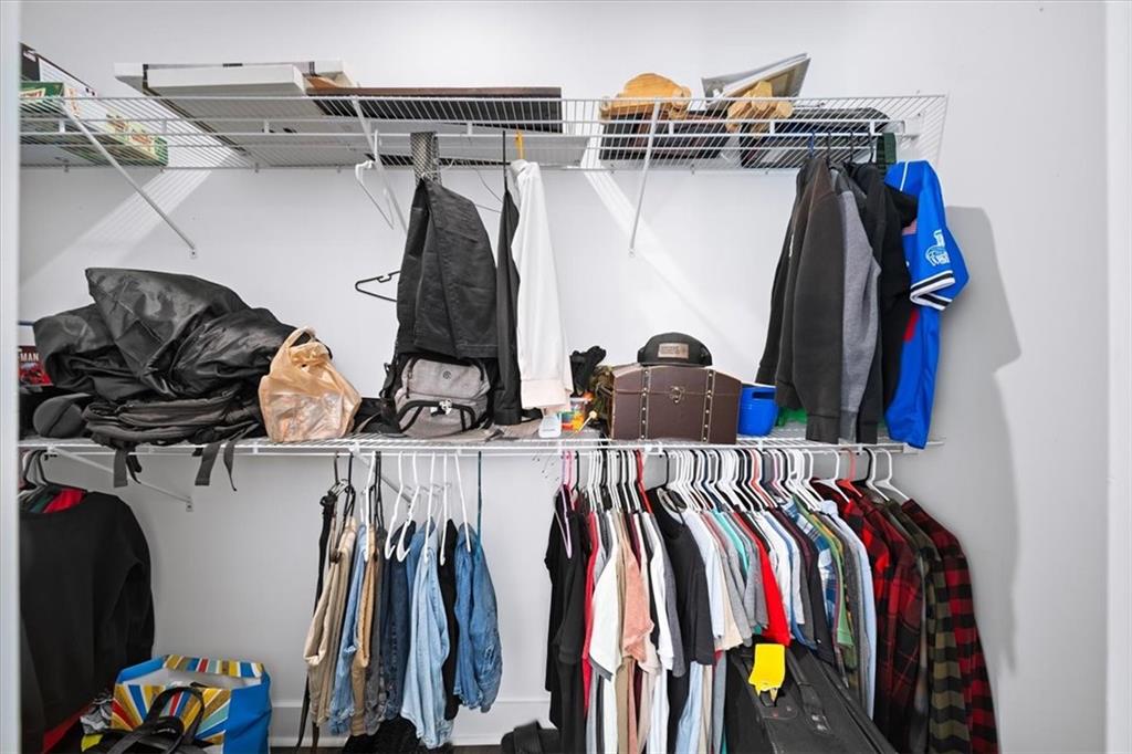 1380 Cronic Town Road Auburn, GA 30011 - Photo 47 of 69 a view of walk in closet with clothes and shoes
