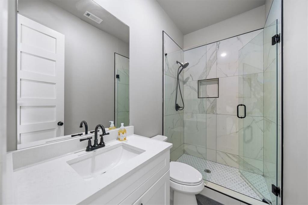 1380 Cronic Town Road Auburn, GA 30011 - Photo 51 of 69 a bathroom with a sink a toilet and shower