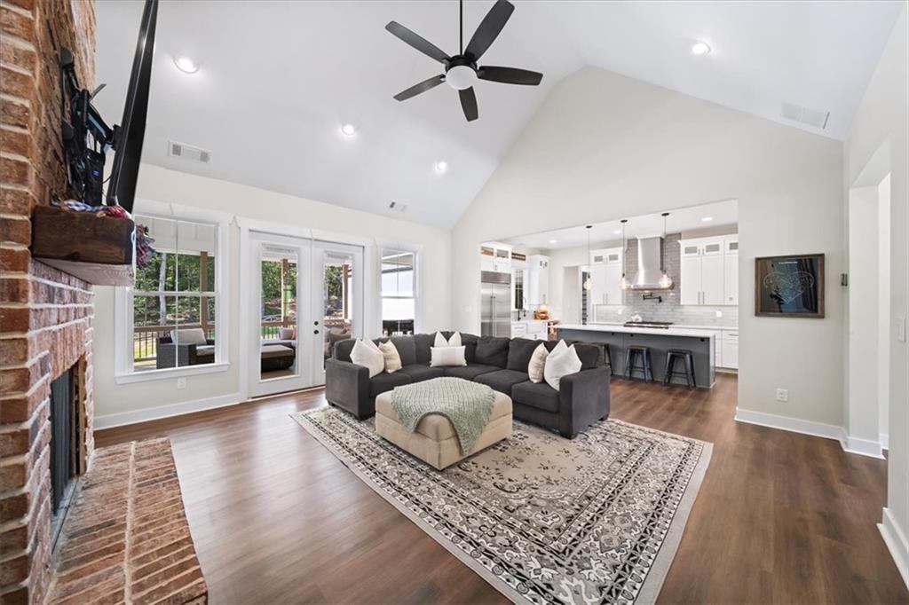 1380 Cronic Town Road Auburn, GA 30011 - Photo 6 of 69 a living room with fireplace furniture and a flat screen tv