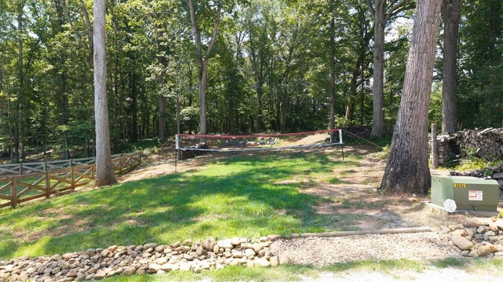 1380 Cronic Town Road Auburn, GA 30011 - Photo 67 of 69 a backyard of a house with table and chairs