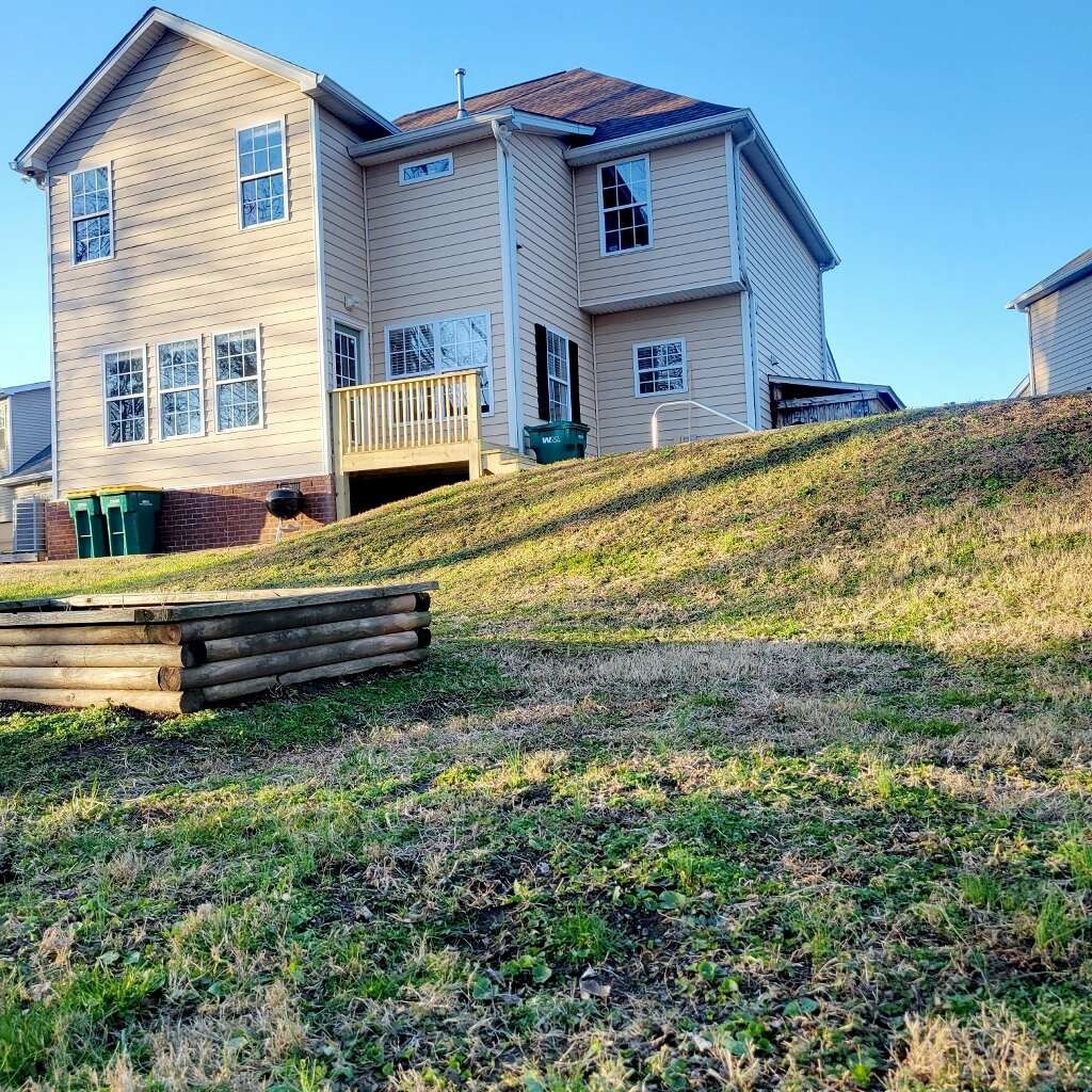 1457 Bern Drive Spring Hill, TN 37174 - Photo 25 of 28 a backyard of a house with yard and porch