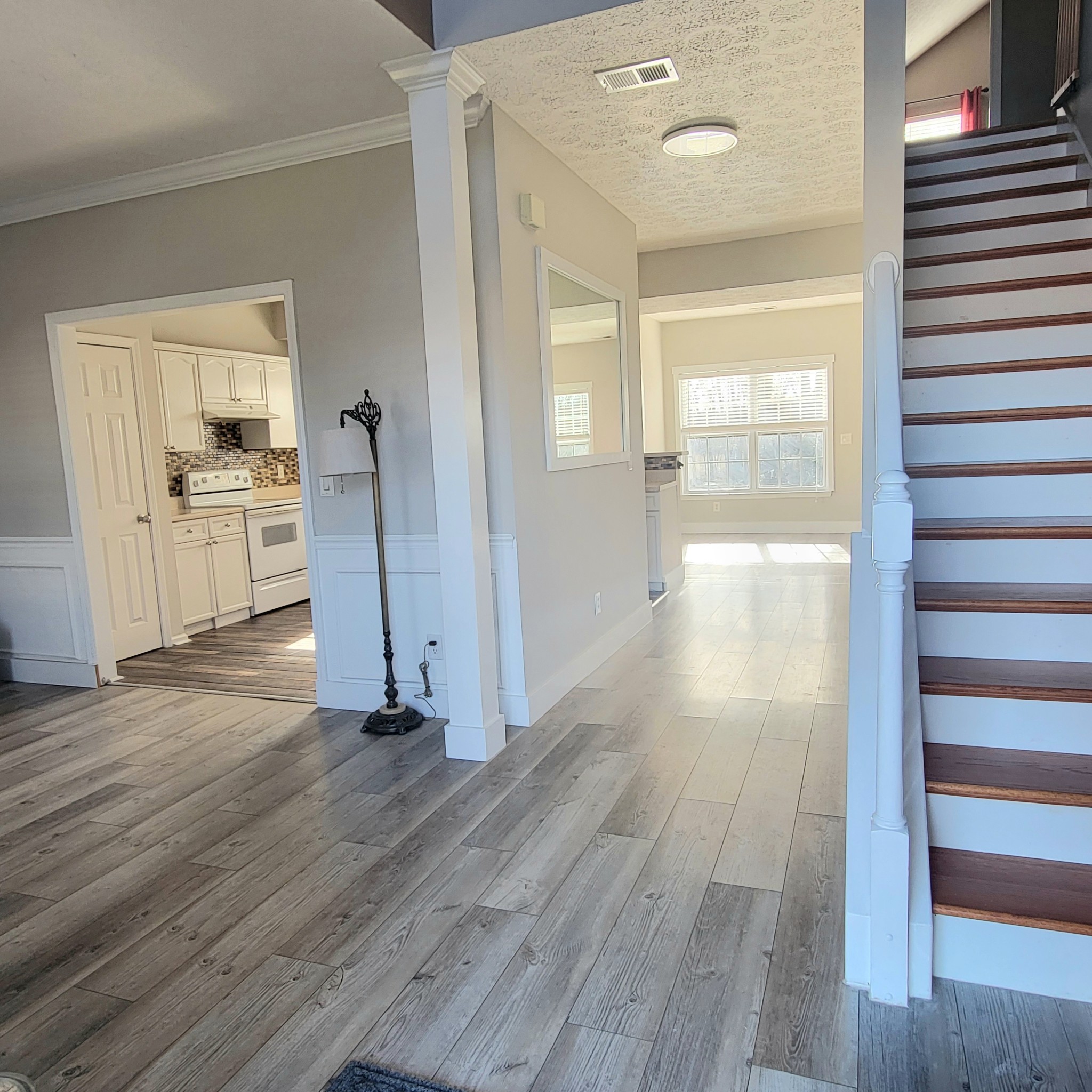 1457 Bern Drive Spring Hill, TN 37174 - Photo 8 of 28 a view of a kitchen with wooden floor and a sink
