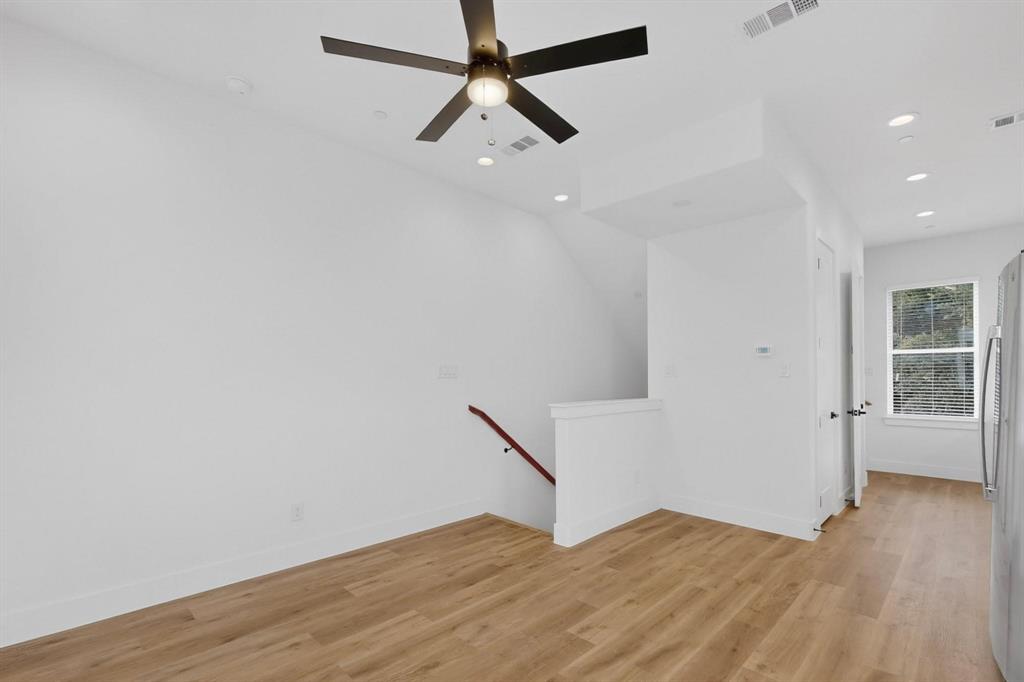 2226 Shea Road, Unit 103 Dallas, TX 75235 - Photo 6 of 35 Open-concept living area with wood-finish flooring, recessed lighting, and a ceiling fan