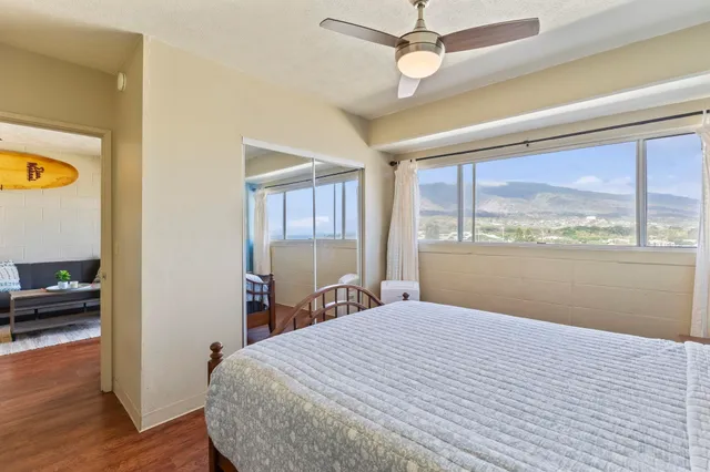 a bedroom with a large bed and a window
