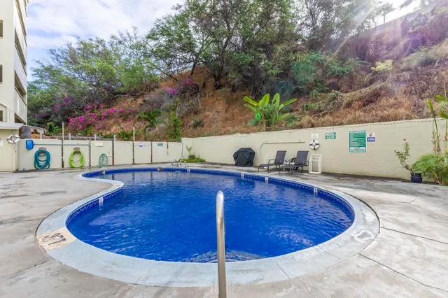 a view of a swimming pool with a patio