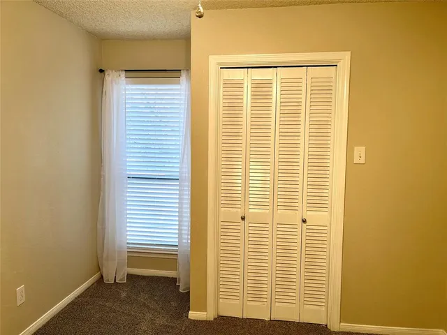 a view of a room that has a window