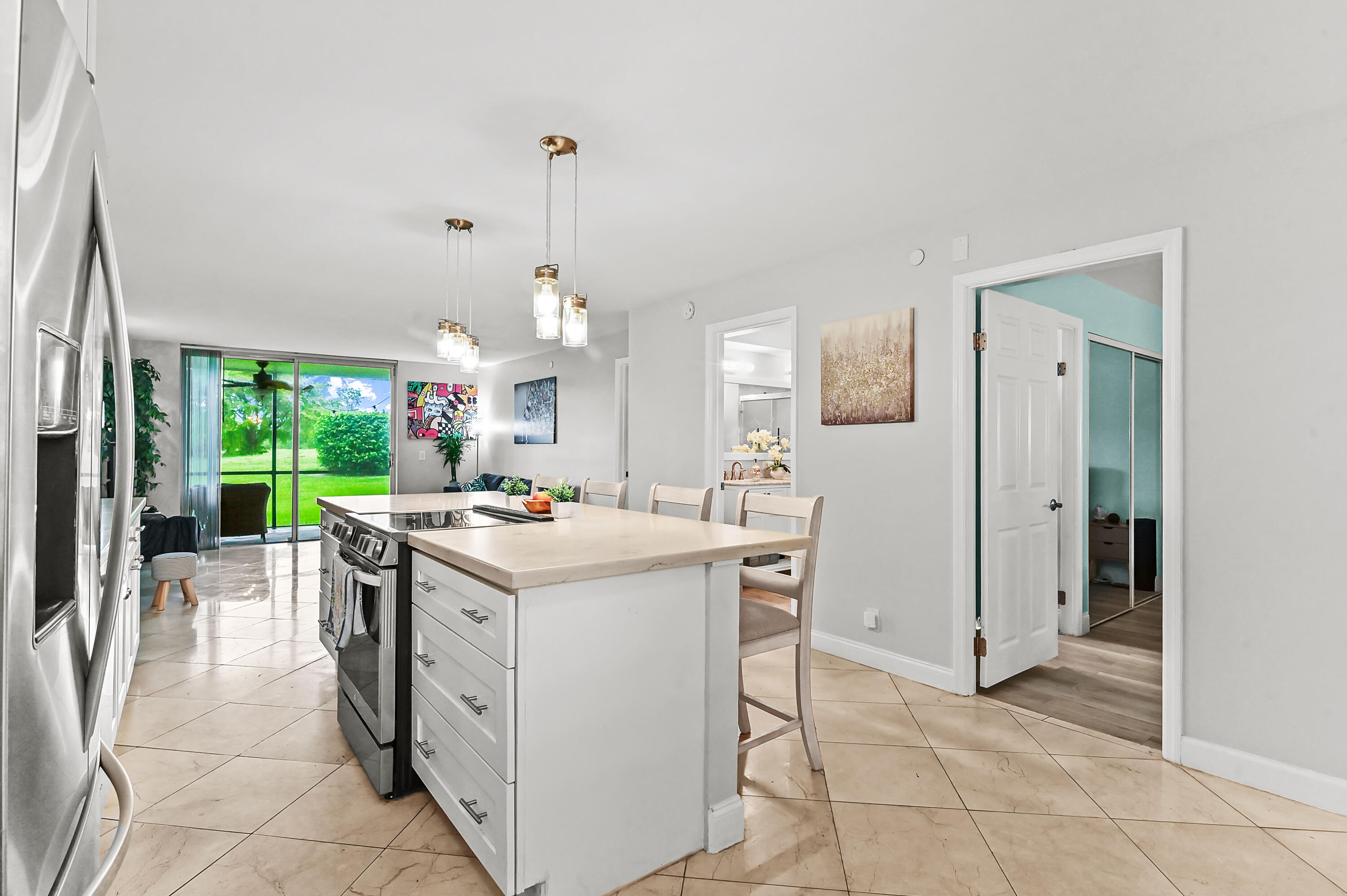 6400 Northwest 2nd Avenue, Unit 124 Boca Raton, FL 33487 - Photo 8 of 33 a kitchen that has a sink a stove and a refrigerator