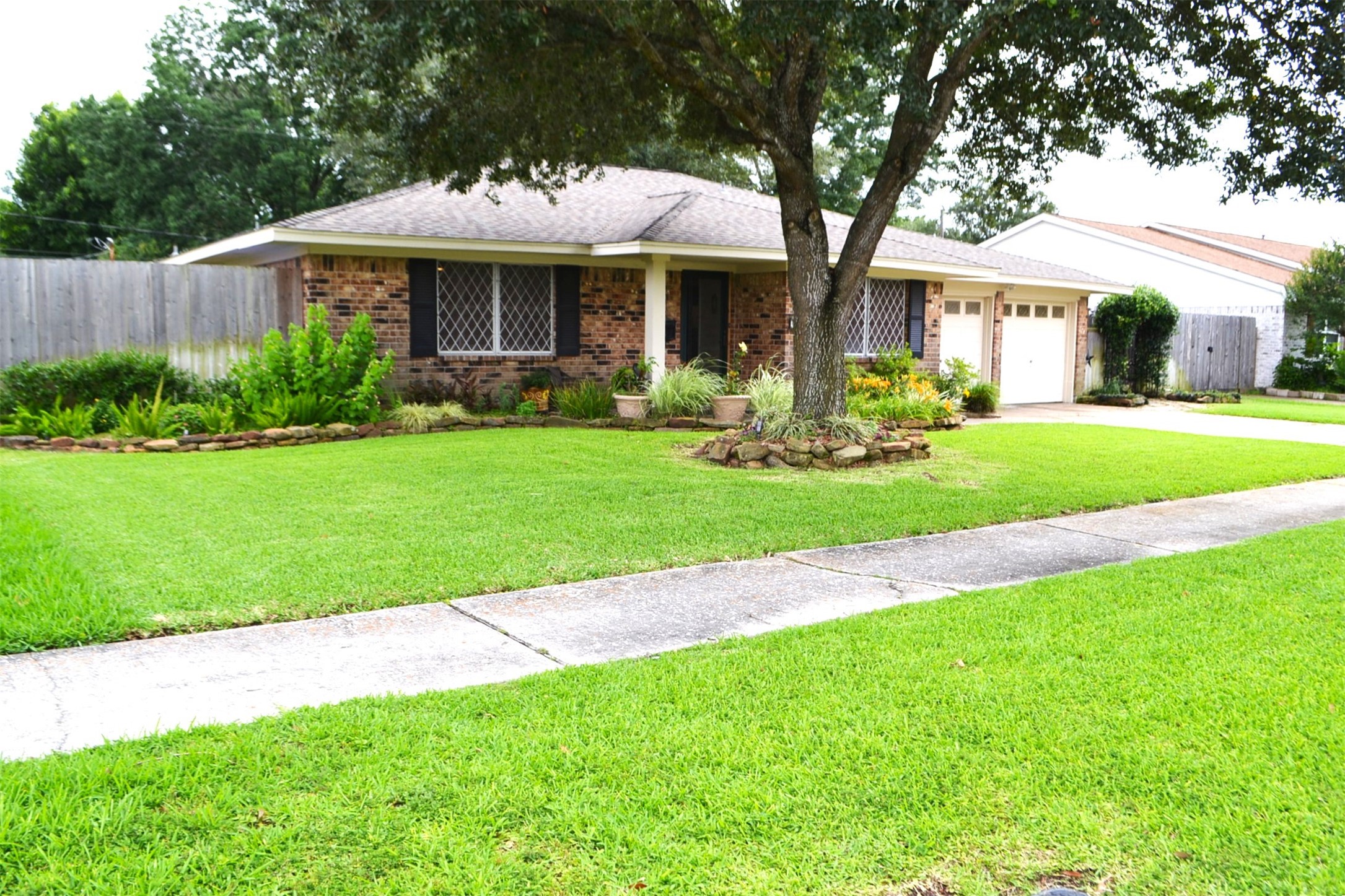 610 East X Street Deer Park, TX 77536 - Photo 2 of 44 a front view of a house with a yard porch and outdoor seating