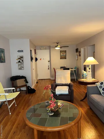 a living room with furniture and a table