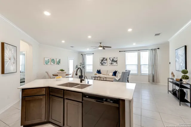 a bedroom with a bed and large windows
