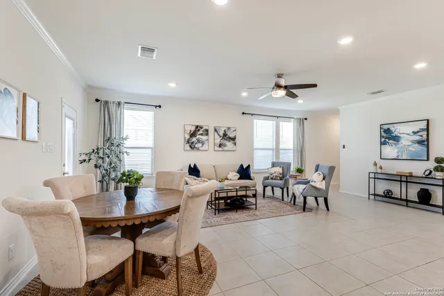 a view of a dining room with furniture and a livingroom