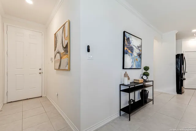 a living room with furniture kitchen view and a table
