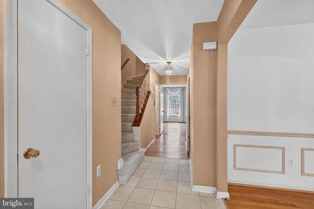 a view of entryway with furniture and wooden floor