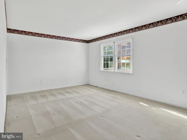 a view of an empty room with windows