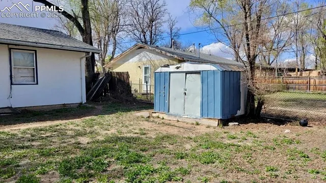 a view of backyard of house