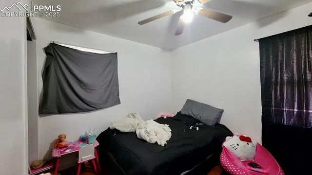 a living room with furniture and a lamp