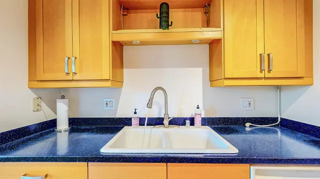 a bedroom with a bed and large window