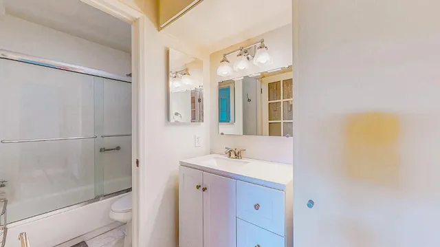 a view of a balcony with wooden floor