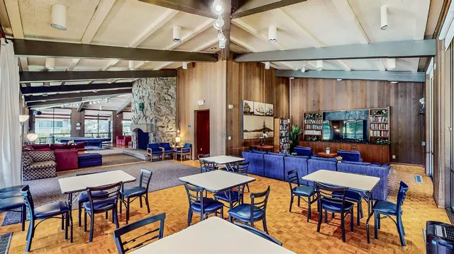 a view of a dining room with furniture window and outside view