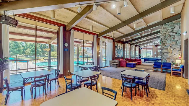 a living room with lots of furniture and a rug