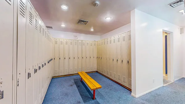 a swimming pool with an outdoor seating and yard