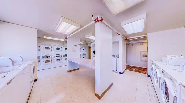 a view of a swimming pool with an outdoor space and seating area