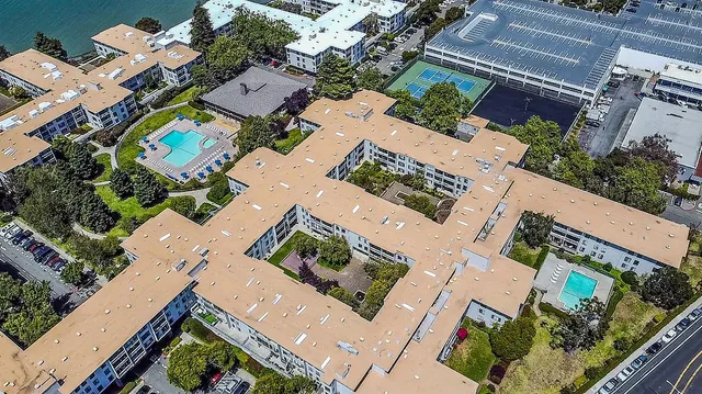 a view of hallway with wooden floor