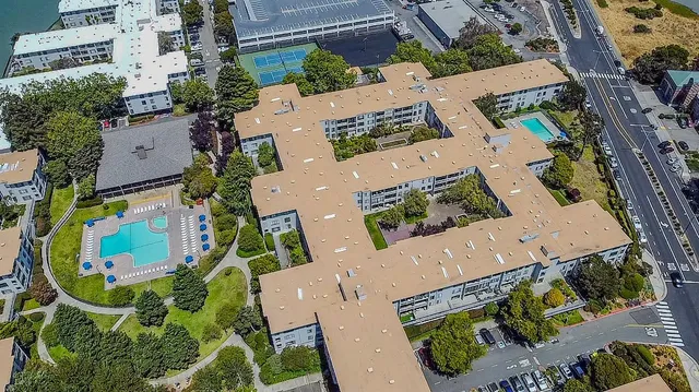 an aerial view of a building with seating space