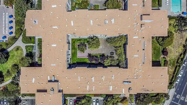 swimming pool view with a seating space
