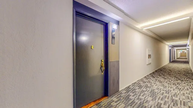 a view of a swimming pool with a dining room