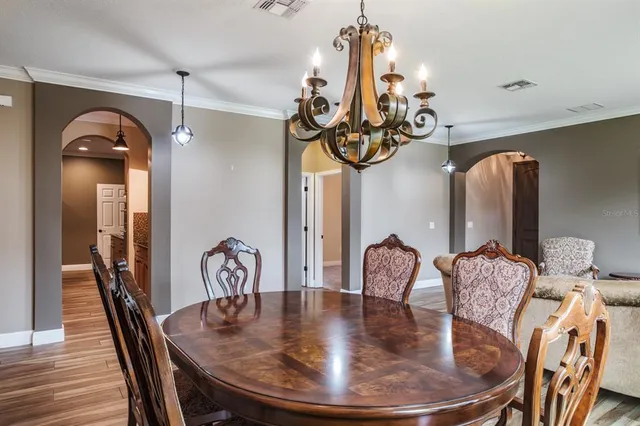 a view of a room with wooden floor and stairs