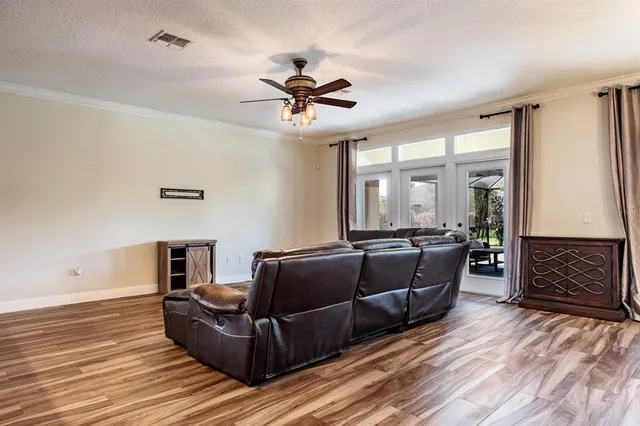 a kitchen with kitchen island granite countertop a sink stove and refrigerator