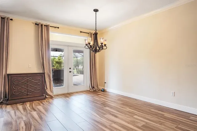 a bathroom with a granite countertop sink a mirror and a shower