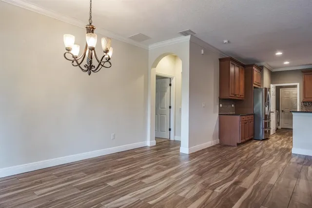 a bathroom with a tub a sink and a mirror