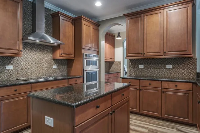 a view of a livingroom with a ceiling fan and chandelier fan