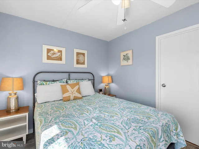 a bedroom with a bed and a lamp