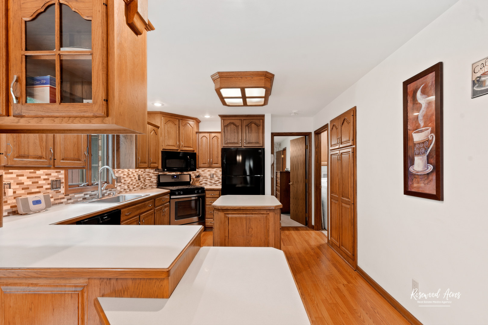 1900 Bittersweet Drive St. Anne, IL 60964 - Photo 7 of 23 a living room with stainless steel appliances furniture a fireplace and a flat screen tv