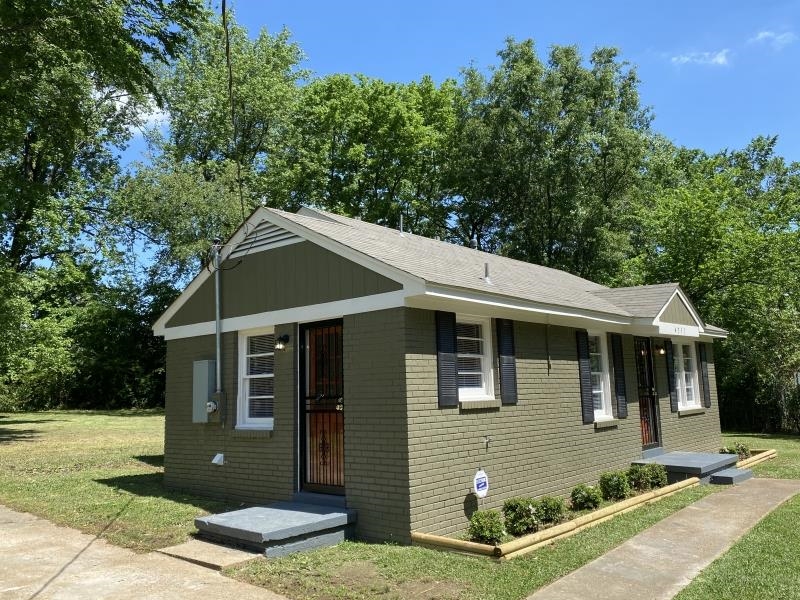 4711 Dalton Road Memphis, TN 38109 - Photo 2 of 8 a view of a house with a yard