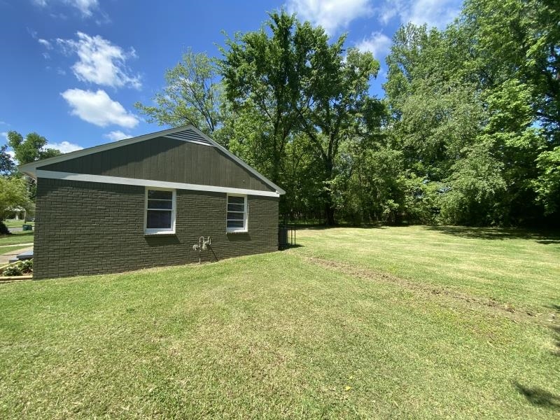 4711 Dalton Road Memphis, TN 38109 - Photo 8 of 8 a front view of a house with yard and green space